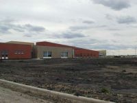 By late May, site work is underway on the north side of S.G. Reinertsen Elementary School.