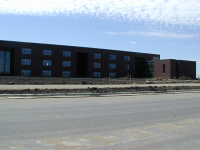 The three-story academic wing at Horizon Middle School contains nine houses with classrooms for core subjects. Brick and windows have been installed to complete the exterior of the school.