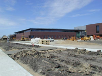 South of the main entrance are music classrooms which surround the cafetorium. The gymnasium and locker room space is to the west of the cafetorium.