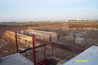 Masonry walls for the gymnasium are under construction.