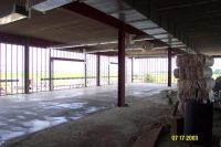 Inside the three-story wing, concrete has been leveled and smoothed.