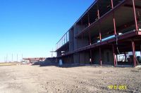 The south side of the three-story portion of the school will eventually be covered with windows.