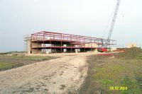 By the first week of June, the framework is erected for the three-story classroom portion of the new middle school.