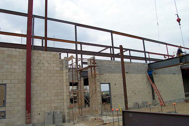 Steel beams are installed to support the floor above.