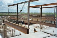 Masonry walls are erected on the second floor of the middle school.