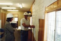 Ken Cote, Kraus Anderson site supervisor, shows the blueprints of the middle school to Minnesota Education Commissioner Cheri Pierson Yecke, who toured the construction Sept. 16.