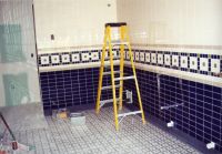 The bathrooms have been updated with new blue, green, tan and white tiles.